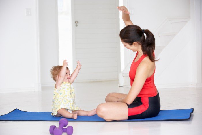 mom and baby on exercise mat
