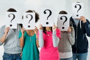 career change: people holding up question mark signages