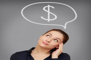 career change: woman thinking with a dollar sign in the thought bubble