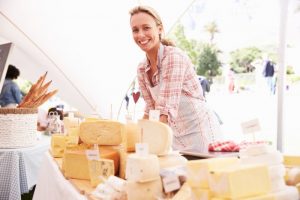 cheese: girl is serving different types of cheeses