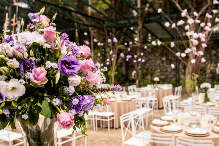 event management: floral arrangement with beautiful chairs and tables