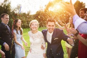 man and woman married and having fun with guests