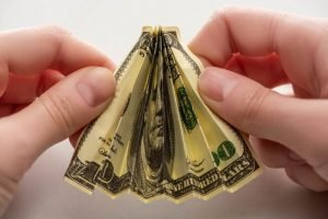 online business courses: a dollar bill folded several times