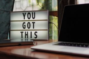 decluttering: a lighted signage on the table that says 'you got this'.