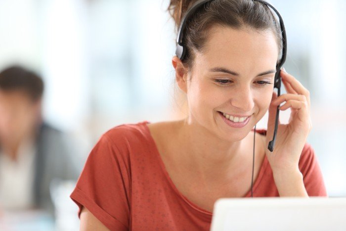 customer service: girl with a headset who is talking to a customer
